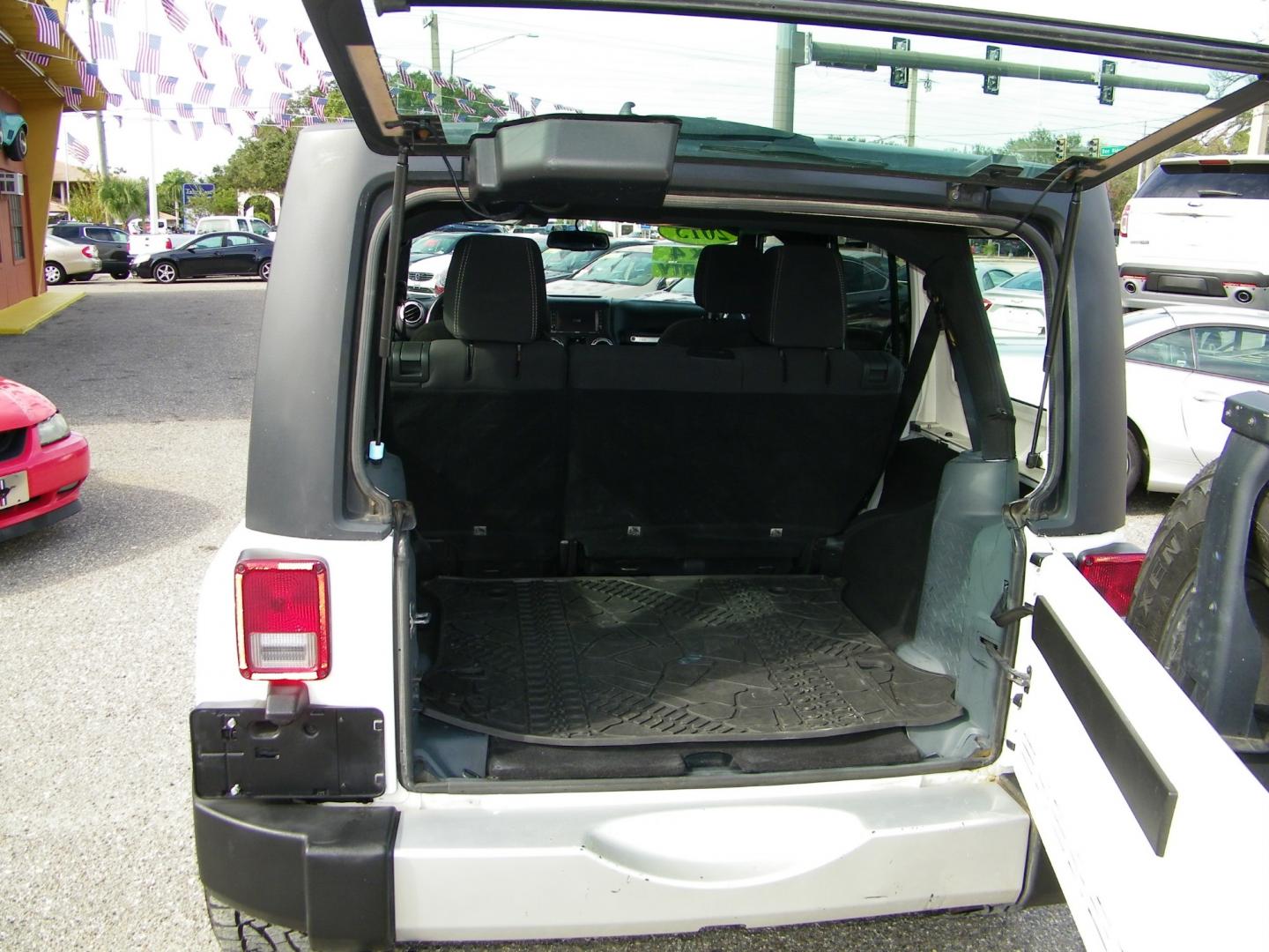 2015 White /Black Jeep Wrangler Unlimited Sahara 4WD (1C4BJWEGXFL) with an 3.6L V6 DOHC 24V FFV engine, Automatic transmission, located at 4000 Bee Ridge Road, Sarasota, FL, 34233, (941) 926-0300, 27.298664, -82.489151 - Photo#13